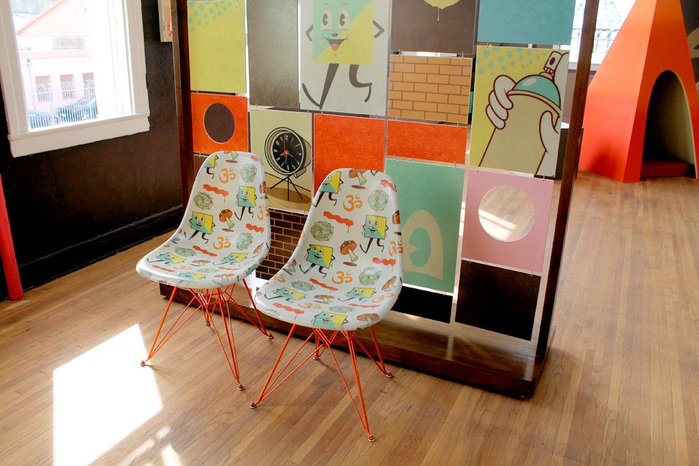 Modernica's collaborative fiberglass chairs, imprinted with Dabs Myla's original designs.
