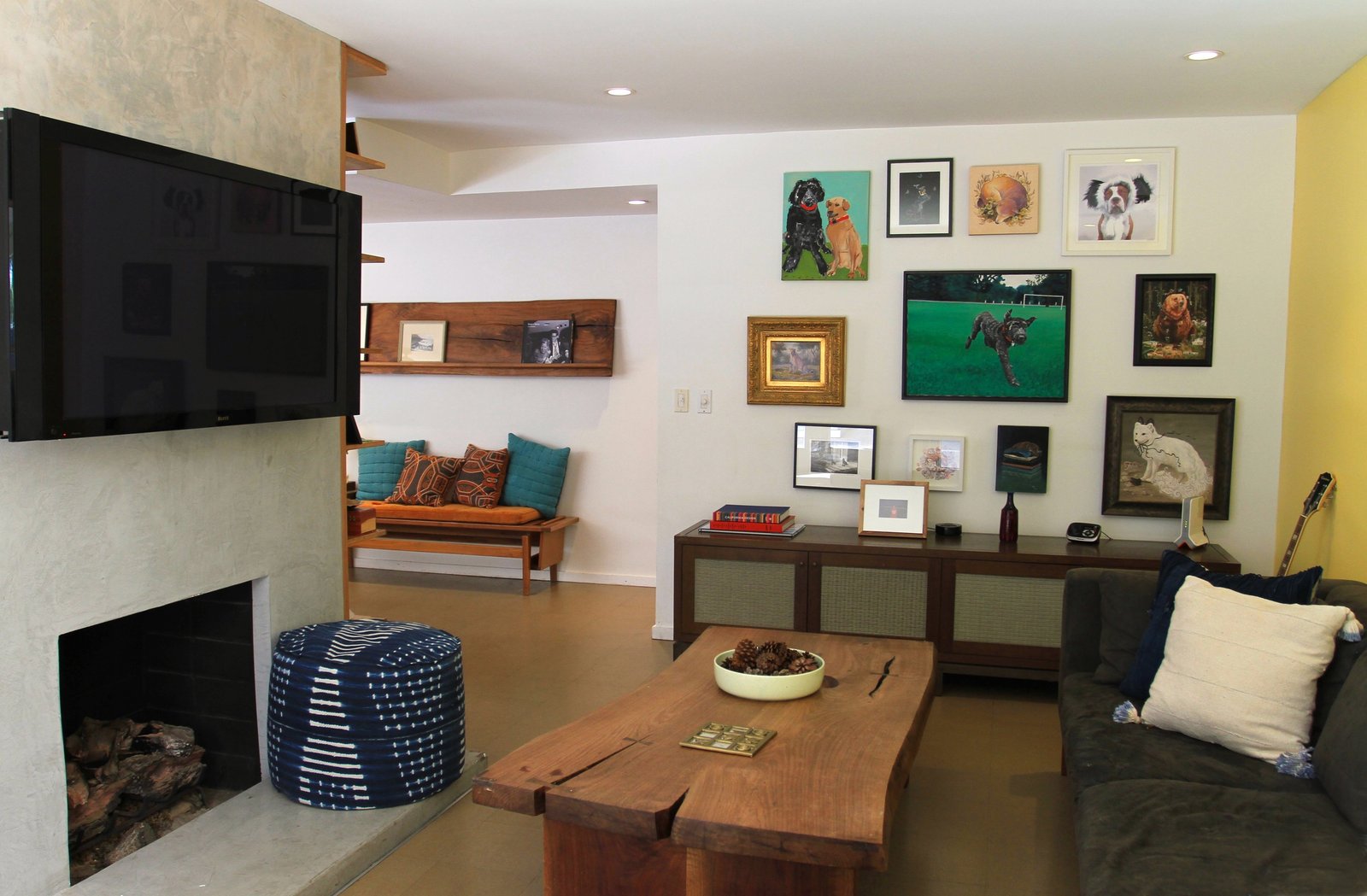 A salon-style assemblage of their many animalium paintings makes the den of these dog lovers even sweeter.&nbsp;