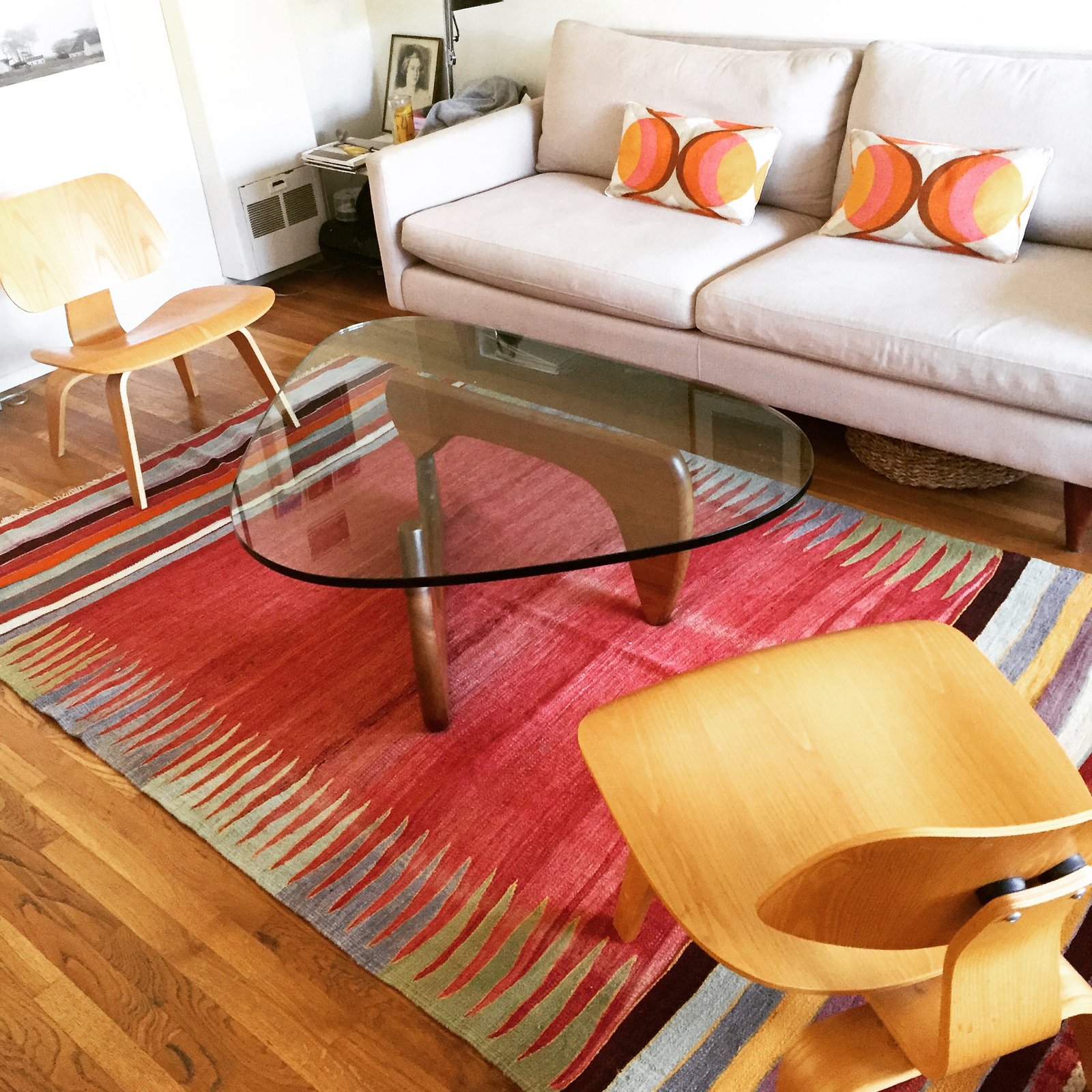 Heather's Noguchi coffee table and Eames molded plywood chairs are now fabulously moored by the colorful Turkish rug we discovered..
